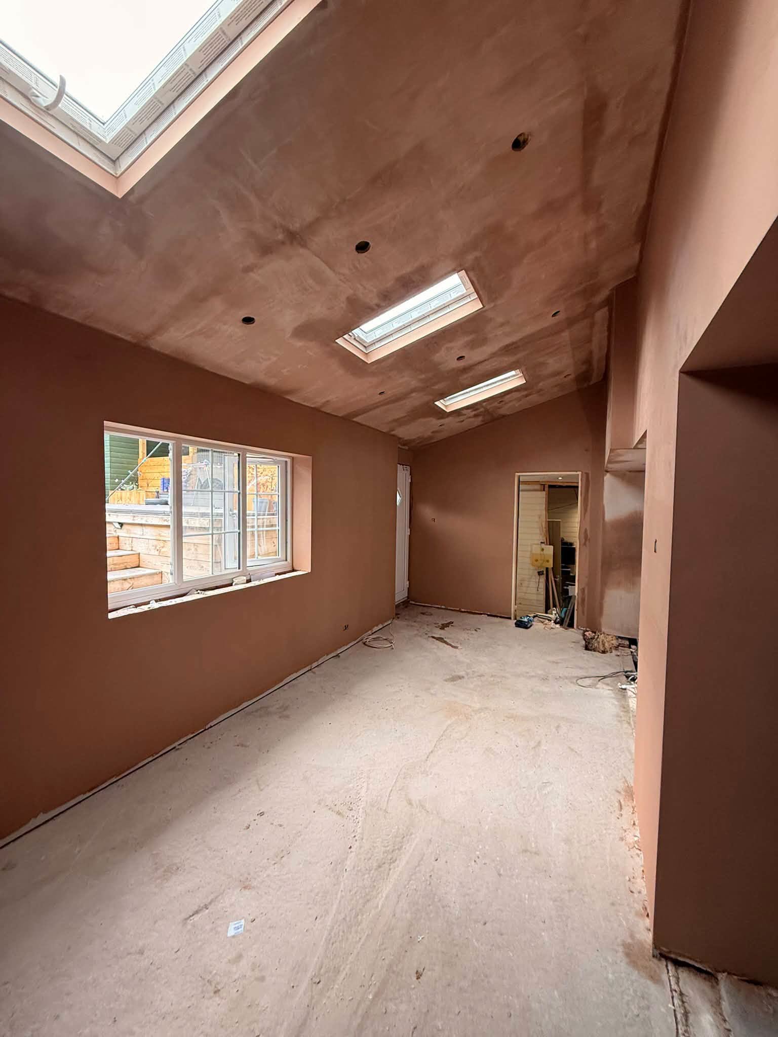 A ceiling skimmed around roof lights